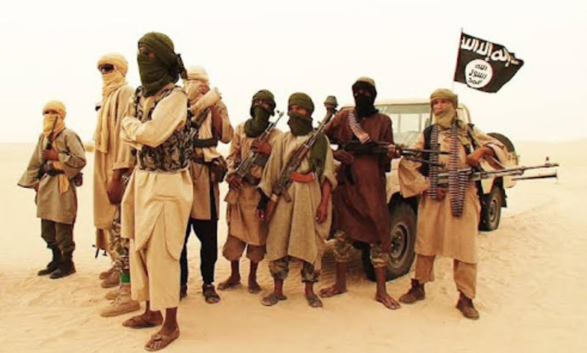 Islamic insurgents standing in desert